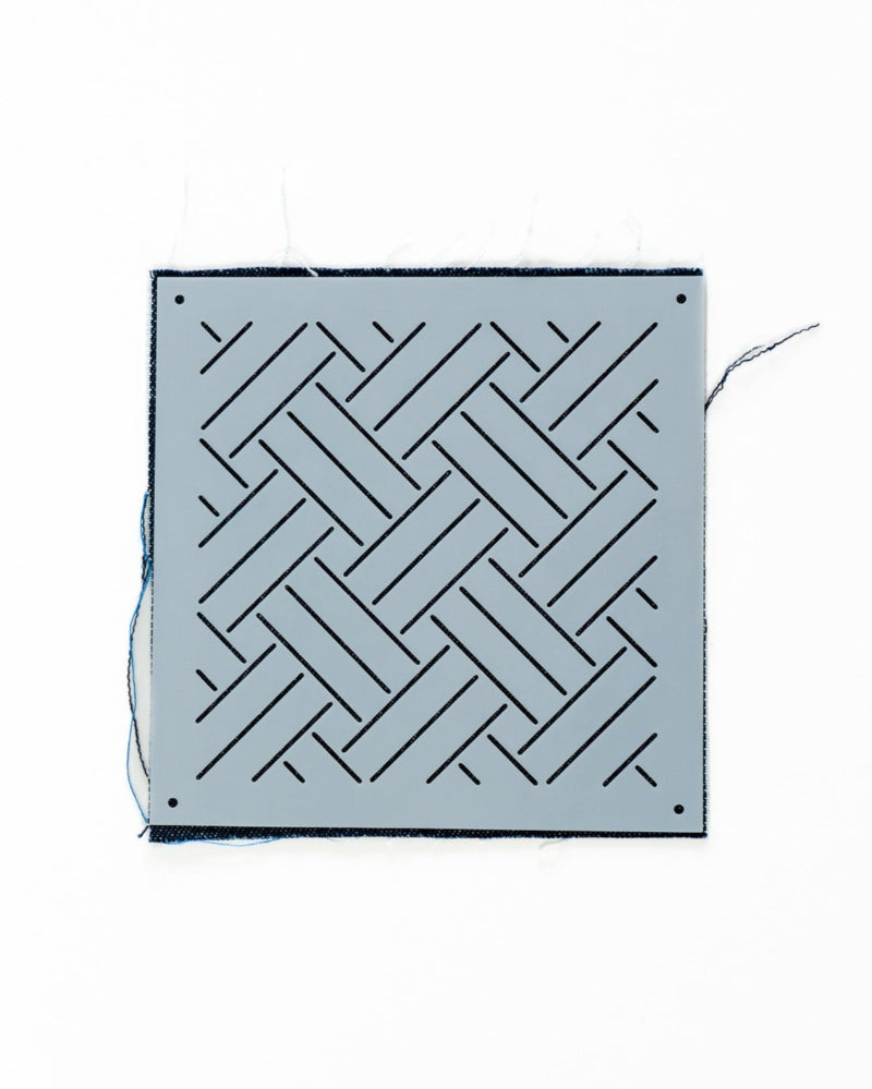 plastic wickerwork stencil on indigo swatch